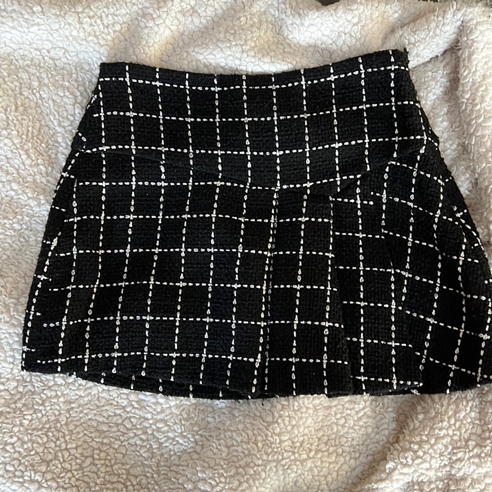 BCBG Generation black skirt with great white stitching detail.
